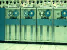 Deteriorated photo of a line of 2400 series tape drives